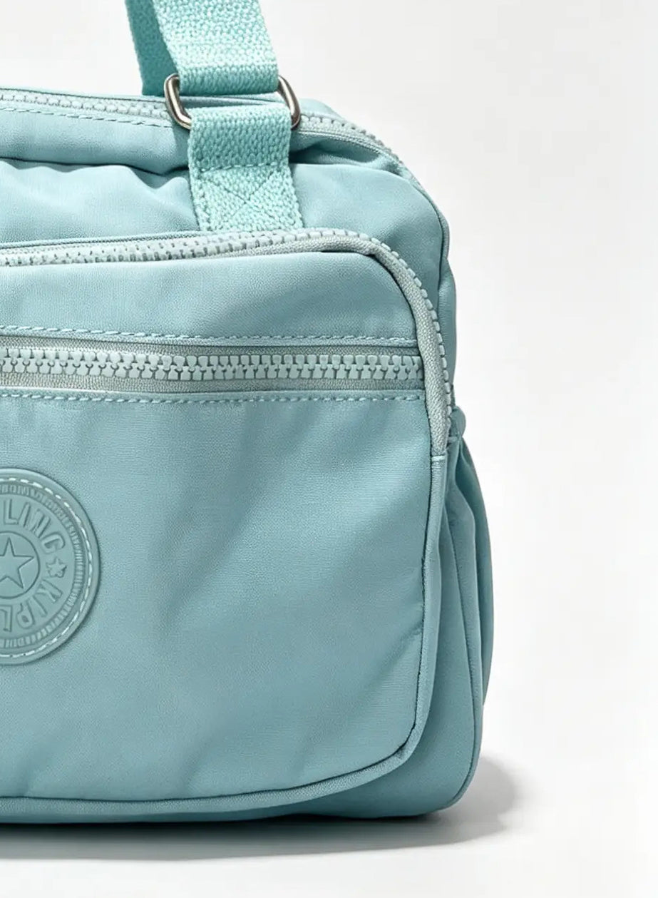 شنطة كروس صغيرة أزرق سماوي بميدالية حيوان | Small Sky Blue Crossbody Bag with Animal Charm