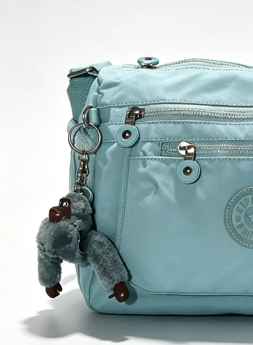 شنطة كروس أزرق سماوي متعددة الجيوب وميدالية حيوان | Sky Blue Crossbody Bag with Multiple Pockets & Animal Charm