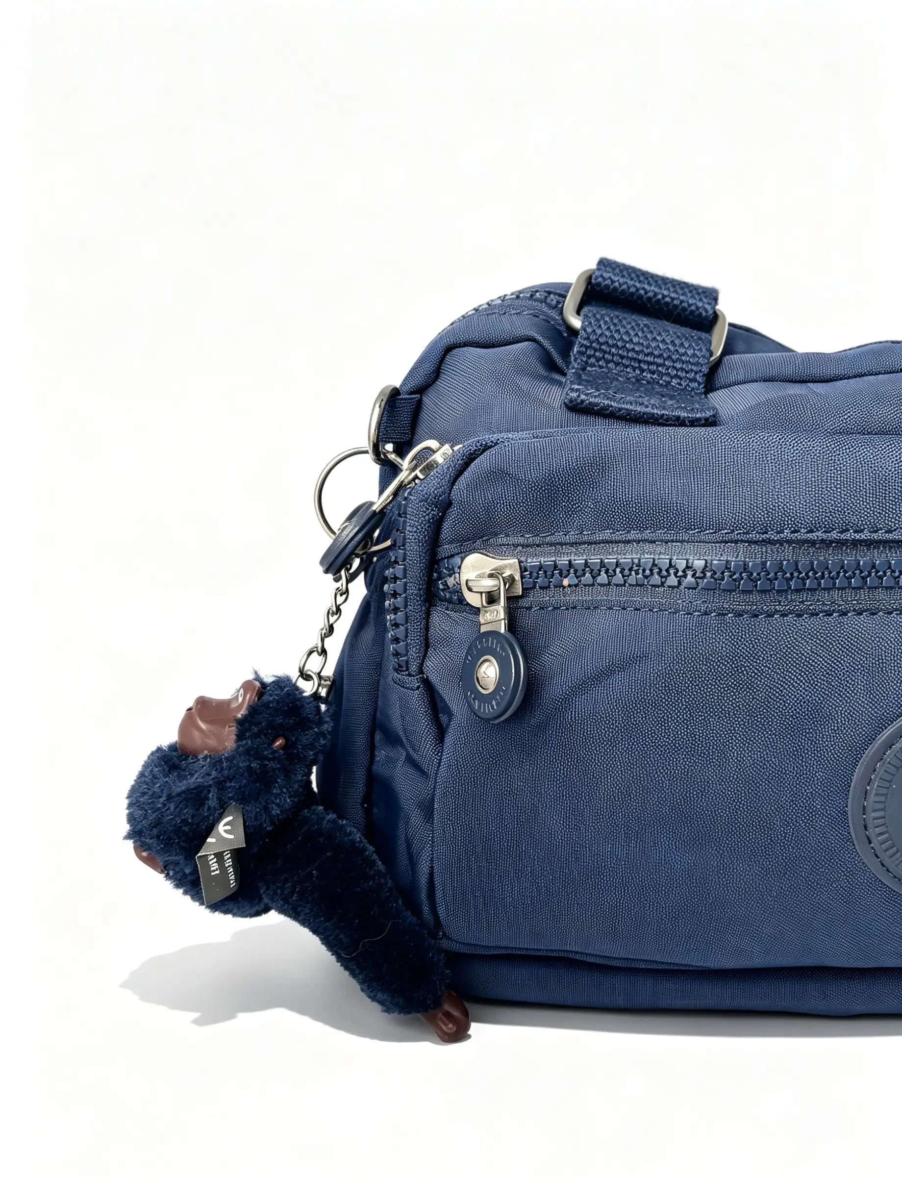 شنطة كروس كحلي متعددة الجيوب وميدالية حيوان | Navy Crossbody Bag with Multiple Pockets & Animal Charm