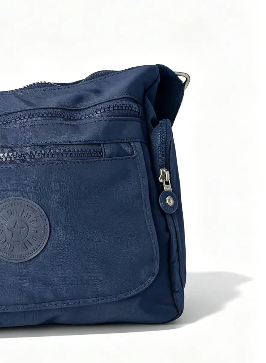 شنطة يد كحلي بجيب أمامي واسع وميدالية حيوان | Navy Handbag with Large Front Pocket & Animal Charm